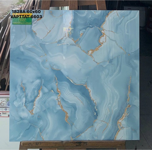 Gạch lát nền 60x60 vân đá marble màu xanh dương phối đường chỉ vàng